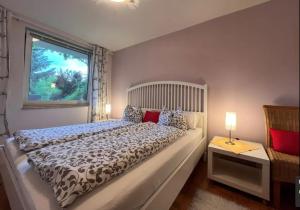 Un pat sau paturi într-o cameră la Ferienwohnung Muthspiel