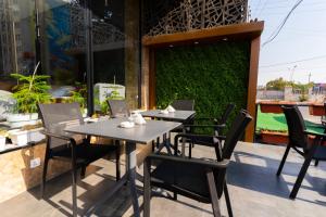 a table and chairs sitting on a patio at Havana View hotel in Erbil