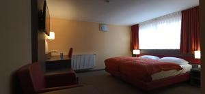 Säng eller sängar i ett rum på Hotel Waldblick
