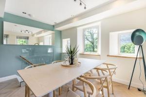 a dining room with a table and chairs at Langdale Boulders, Ambleside, Fantastic views in Chapel Stile