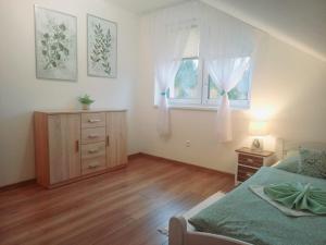 Posteľ alebo postele v izbe v ubytovaní Apartmán pod Sivým vrchom
