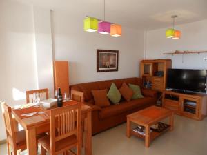 a living room with a couch and a table at MH38 - Apartment with wonderful sea views in Murcia