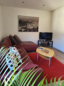 a living room with a couch and a coffee table at Burgener Burgblick in Burgen