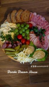 a plate of food with different types of food at Domek Parzenica z balia in Poronin