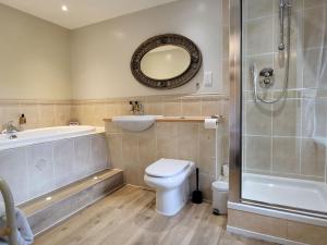 a bathroom with a toilet and a sink and a shower at The Morritt Hotel in Barnard Castle