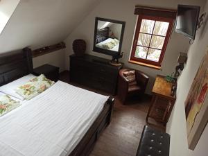 Posteľ alebo postele v izbe v ubytovaní Penzion Rozmarýn