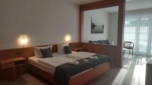 Postel nebo postele na pokoji v ubytování Hotel Am Meilenstein