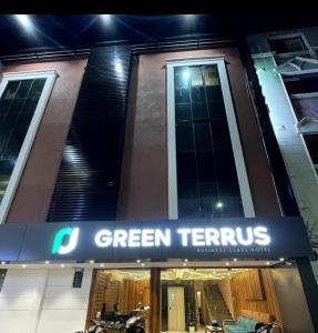 a green territic sign on the front of a building at GREEN TERRUS BUSINESS CLASS HOTEL in Chennai