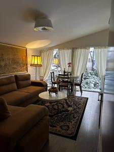 a living room with a couch and a table at Cosy apartment in Kaunas