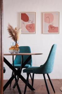 a dining room with a table and two chairs at La Carmona House in Lodero