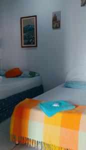 מיטה או מיטות בחדר ב-Cantinho da Rota