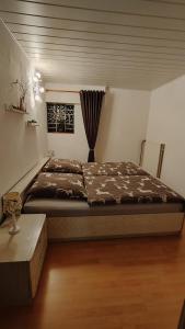 a bedroom with a large bed in a room at Sauerland Alm Winterberg 5 in Hallenberg