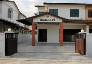 a building with the entrance to a building with a gate at H2H - Bintang49 Vacation House in Ipoh