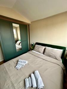a bedroom with a bed with two towels on it at Casa Valprato in Turin