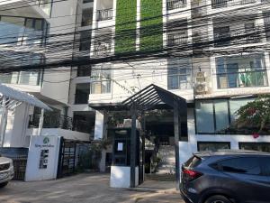 a car parked in front of a building at Vientiane city center modern apartment in Vientiane