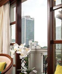 a room with a window with a view of a city at Thien Thai Hotel & Spa in Hanoi