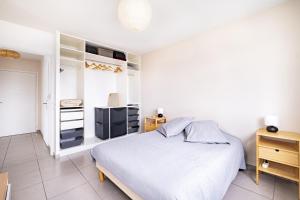 Łóżko lub łóżka w pokoju w obiekcie Appartement T2 neuf - Grande Terrasse de 25m2
