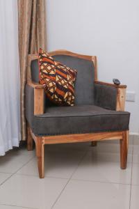 a couch with two pillows sitting on top of it at VIJIJI HOTEL & CONFERENCE in Eldoret