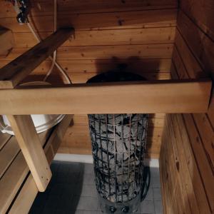 an inside view of a sauna with a wooden floor at Villa Niva in Rovaniemi
