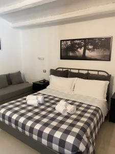 Postel nebo postele na pokoji v ubytování B&B Agriturismo 'A Cunziria