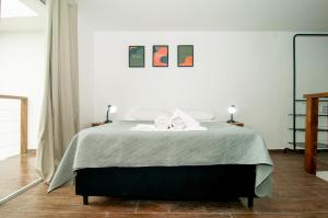 Łóżko lub łóżka w pokoju w obiekcie Loft da Lagoinha a 600 metros da Praia YJ9666