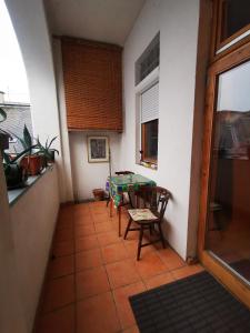 a room with a table and chairs in a kitchen at High Sky Apartment in Budapest +4 photos