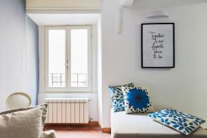 a living room with a couch and a window at iFlat Wonderful Home in Monti in Rome