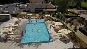 an overhead view of a swimming pool with people in it at L'authentique in La-Roche-en-Ardenne
