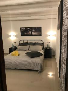 Postel nebo postele na pokoji v ubytování B&B Agriturismo 'A Cunziria