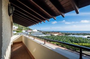 a balcony with a view of the ocean at Quinta D. Maria & Inês in Vila Franca do Campo