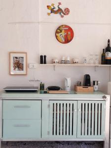 a white desk with a laptop on top of it at Casa Trullo Bianco: Casa Limone in Ceglie Messapica