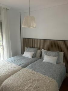 Łóżko lub łóżka w pokoju w obiekcie Luxury Sunny Villa