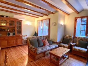 a living room with couches and a coffee table at Rústic de Llavorsí in Llavorsí