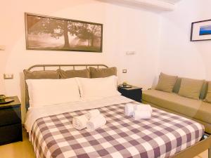 Postel nebo postele na pokoji v ubytování B&B Agriturismo 'A Cunziria