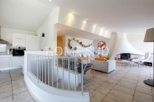a kitchen and living room with a staircase in a house at HSUD0085-Sansovino in Cannes