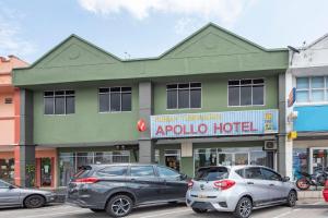 a building with cars parked in front of it at Apollo Hotel Johor Bharu in Johor Bahru