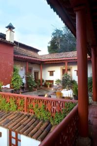 an outside view of a house with a fence at Hotel Boutique Posada La Basilica in Pátzcuaro