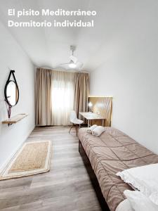 מיטה או מיטות בחדר ב-El pisito mediterráneo