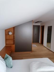 Postel nebo postele na pokoji v ubytování Hotel Garni Tannleger B&B