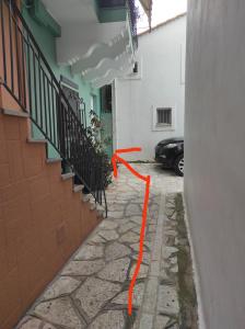 an orange cord on the side of a building at Andriana's studio in Parga