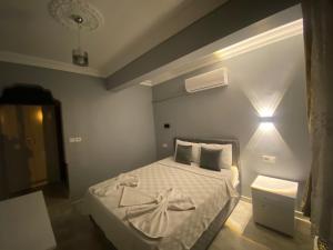 Кровать или кровати в номере Aspawa Hotel
