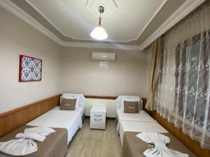 Кровать или кровати в номере Aspawa Hotel