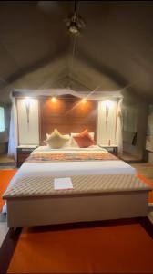 a bedroom with a large bed in a room at Luluka Guest House in Sekenani