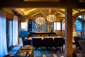 a dining room with a table and chairs at Au Coeur du Village in La Clusaz