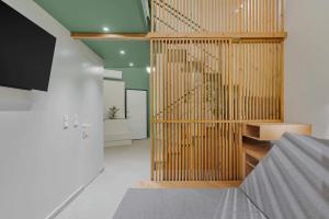 a room with a staircase with wood dividers at Mystique Loft Ioannina in Ioannina