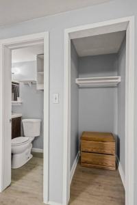 a bathroom with a toilet and a wooden drawer at Charming retro property! in Sparks
