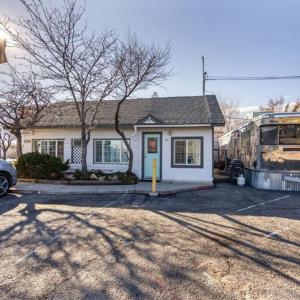 a house with a bus parked in front of it at Charming retro property! in Sparks