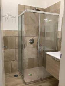 a shower with a glass door in a bathroom at Casa Vacanze Agape in Positano +39 photos