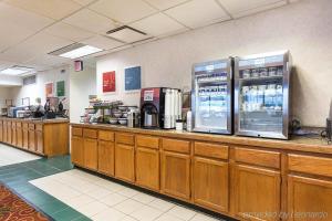 a restaurant with two refrigerators on a counter at Comfort Inn Falls Church - Tysons Corner in Falls Church