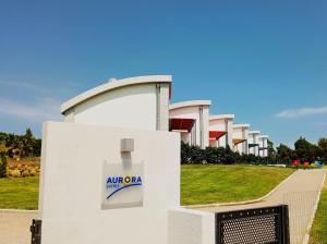 a building with an air olia sign on it at Aurora Suites in Nea Fokea